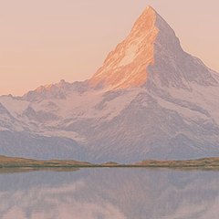 A mountain peak at dawn: Alpenglow